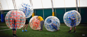 Playing in inflatable balls in a sports hall