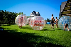 Players in bubble football balls – Kraków
