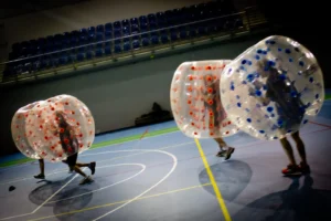 Bumper Ball match in a hall – players colliding