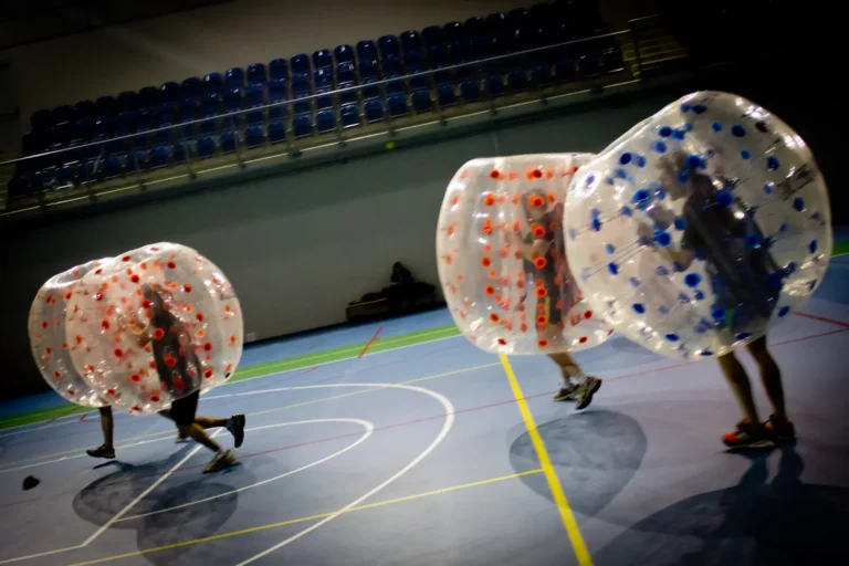 Bumper Ball match in a hall – players colliding